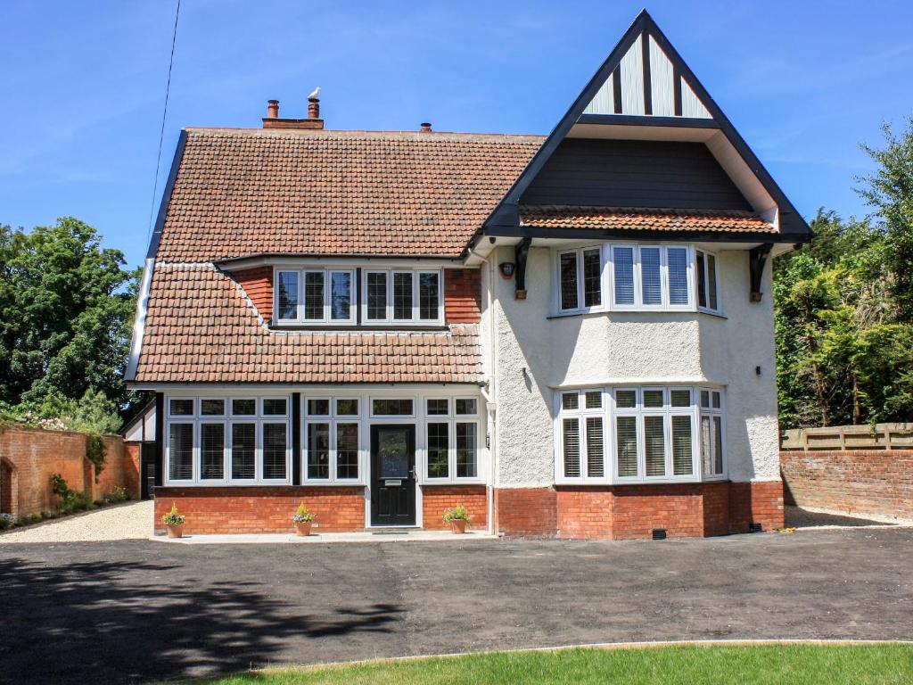 a large brick house with a roof at Greenlawns in Burnham on Sea