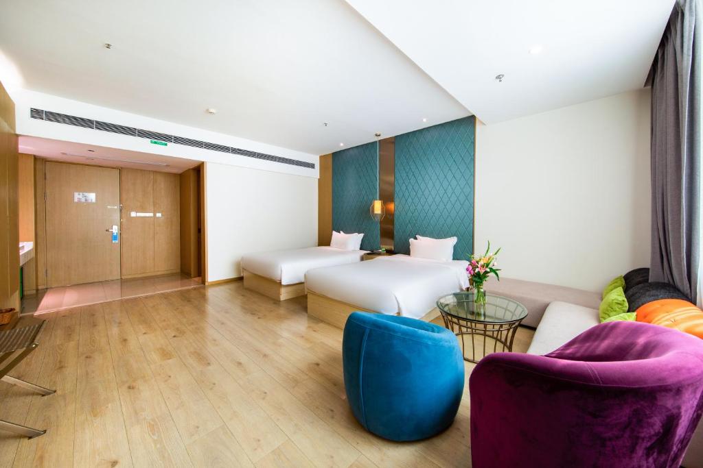Postel nebo postele na pokoji v ubytování Ibis Styles XM Zhongshan Hotel