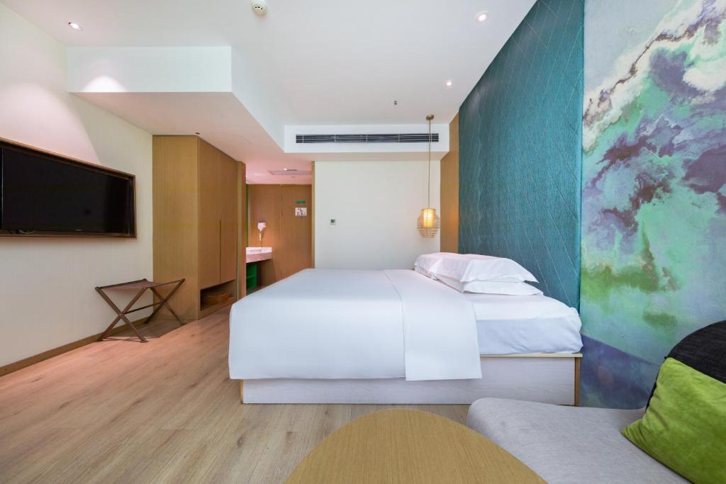 Postel nebo postele na pokoji v ubytování Ibis Styles XM Zhongshan Hotel