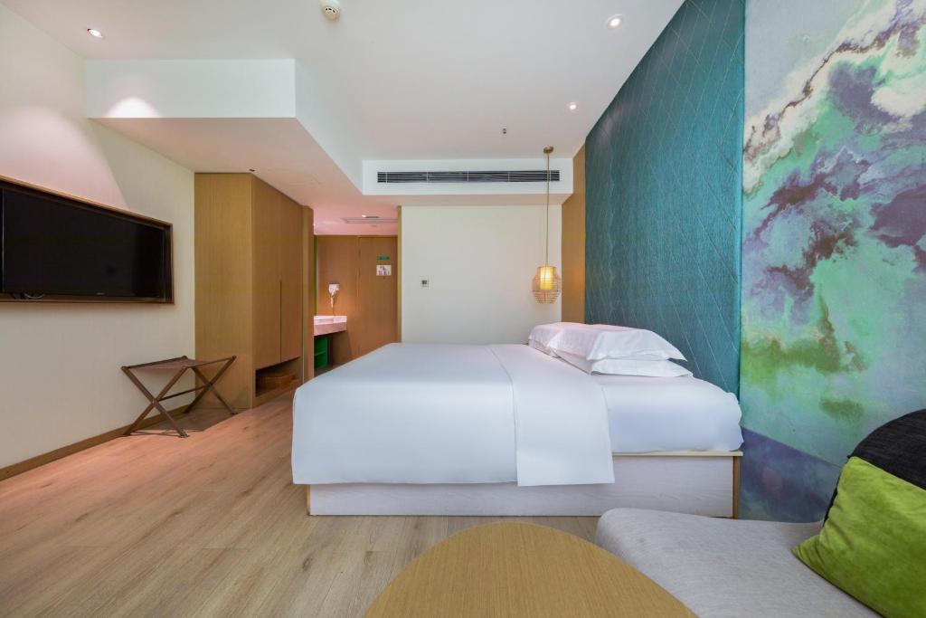 Postel nebo postele na pokoji v ubytování Ibis Styles XM Zhongshan Hotel