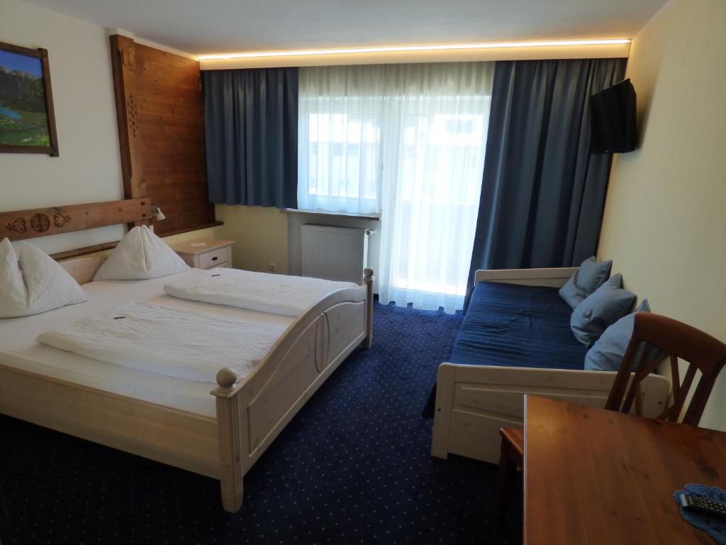 Postel nebo postele na pokoji v ubytování Panoramahotel