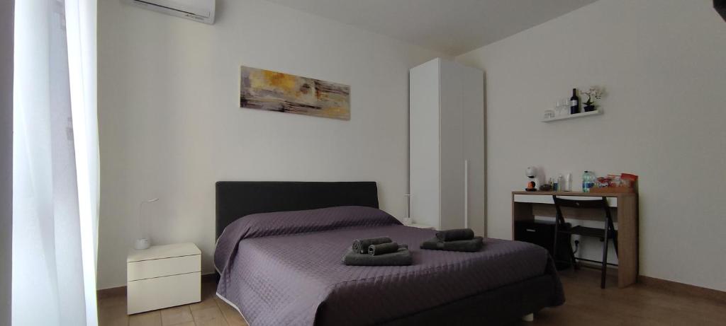 a small bedroom with a bed and a table at G21 Guest House in Rome