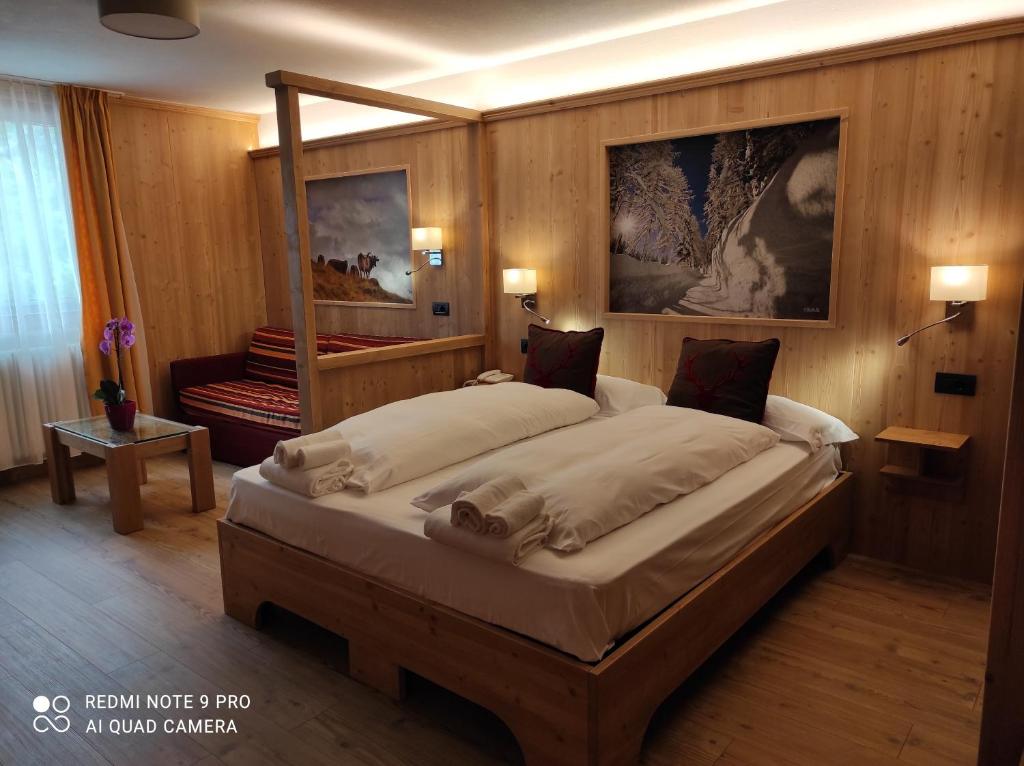 Postel nebo postele na pokoji v ubytování Alps Oriental Wellness HOTEL