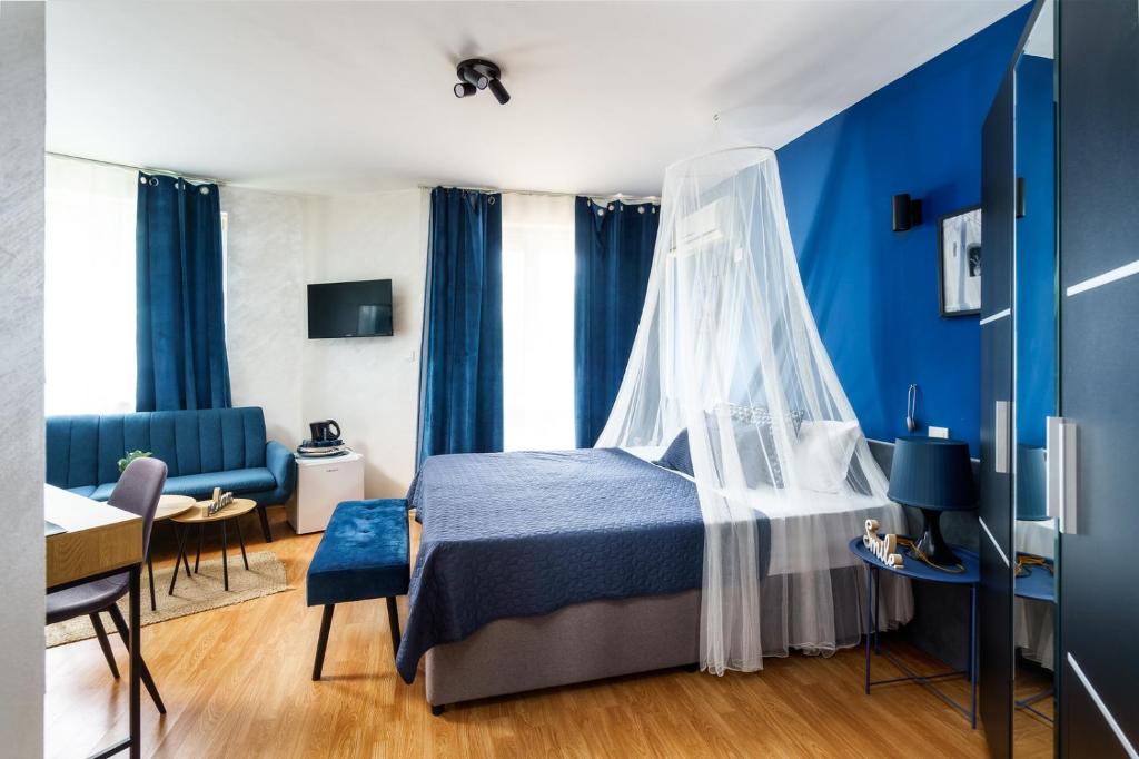 Postel nebo postele na pokoji v ubytování Sunrise Hotel