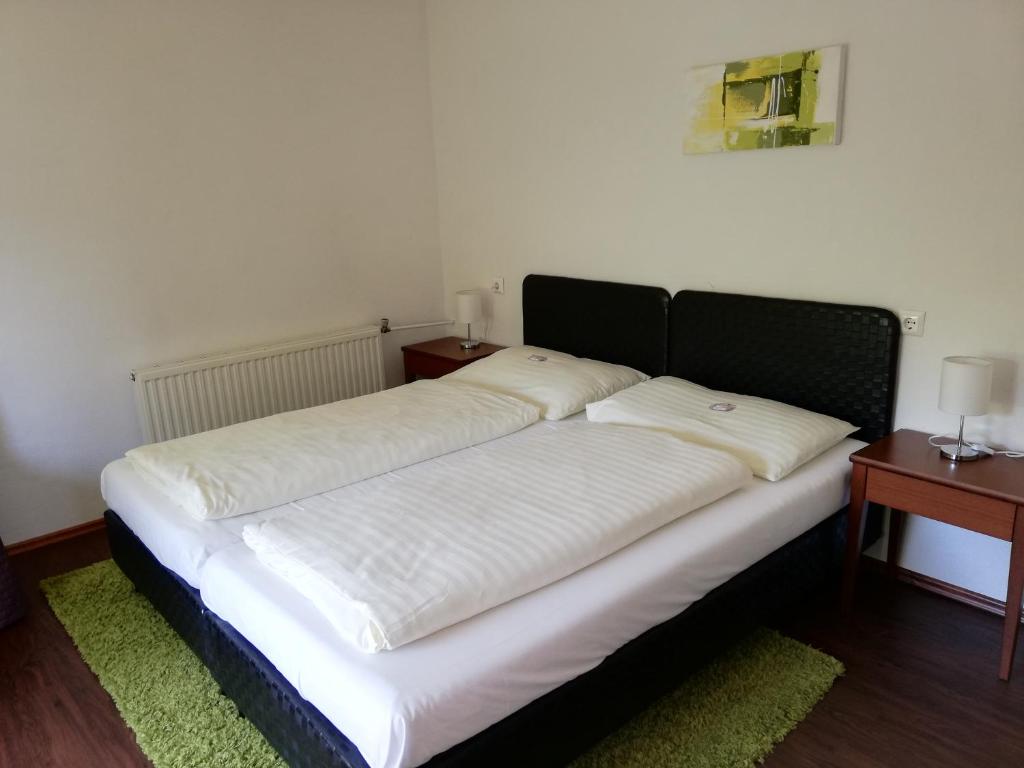 Voodi või voodid majutusasutuse Hotel Faaker See Inn by S4Y toas