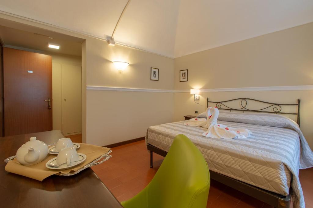 Postel nebo postele na pokoji v ubytování Hotel Antica Dogana