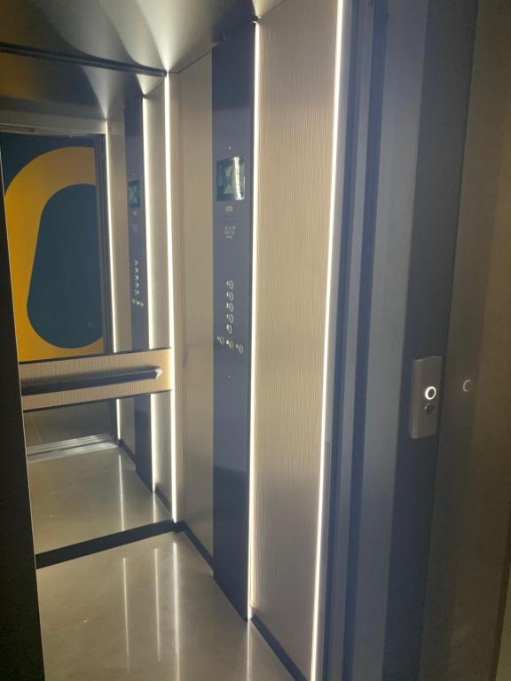 an empty elevator in a building with a door at MAR60 Apartments in Caorle