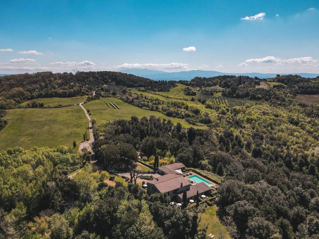 an aerial view of a house in the middle of a field at La Melosa Resort & Spa in Roccastrada