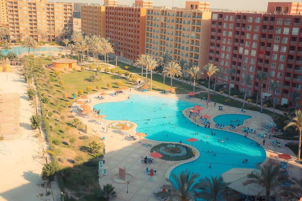 an aerial view of a swimming pool in a resort at Porto Golf Marina in El Alamein