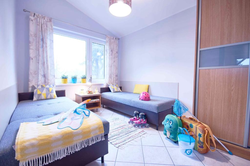 Posteľ alebo postele v izbe v ubytovaní Arenda Apartamenty&Domki całoroczne