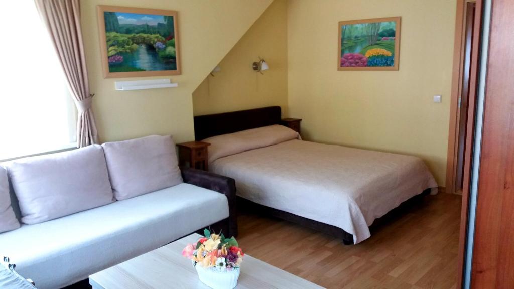 Postel nebo postele na pokoji v ubytování Vila Liepa