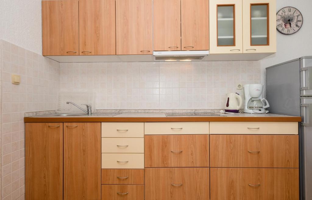 Kuchyň nebo kuchyňský kout v ubytování Apartments Halovic