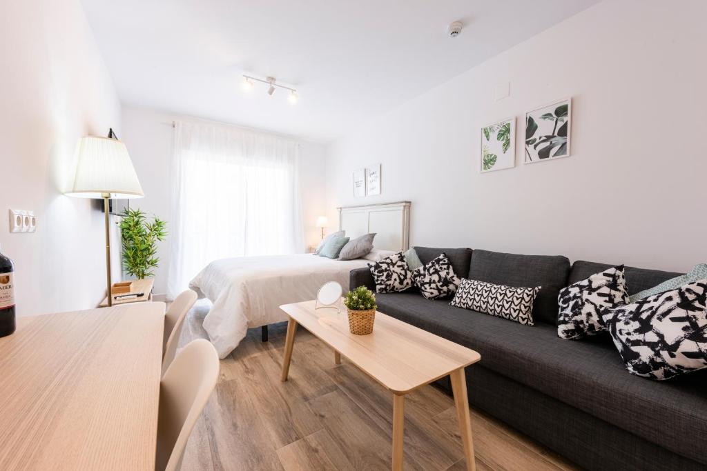 Posedenie v ubytovaní Apartamentos Toboso Plaza
