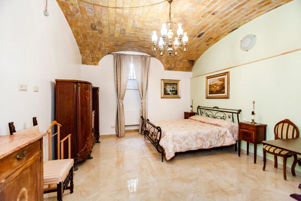 Ένα ή περισσότερα κρεβάτια σε δωμάτιο στο Stop Colosseo