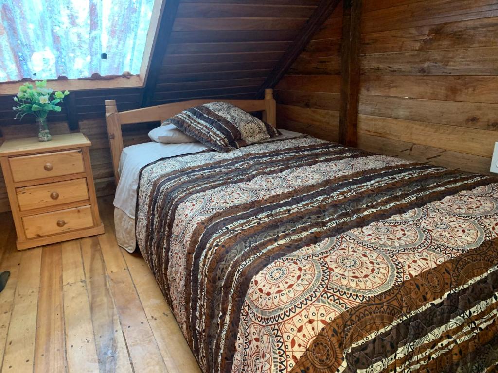 Postel nebo postele na pokoji v ubytování Colinas de Mindo