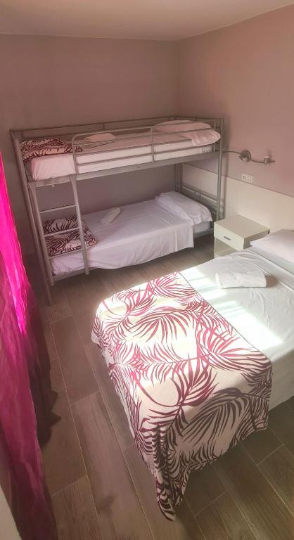 Postel nebo postele na pokoji v ubytování Hostal La Cabaña