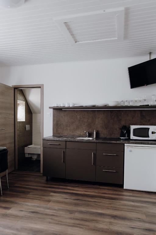 Kuchyň nebo kuchyňský kout v ubytování Nyírfa Apartman