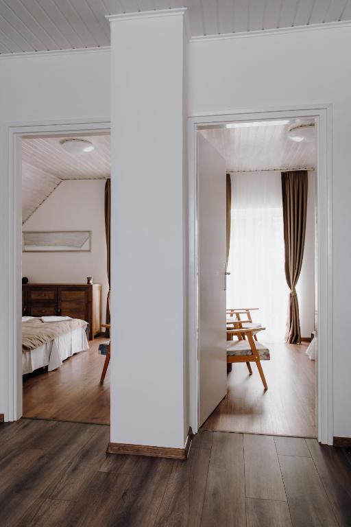 Postel nebo postele na pokoji v ubytování Nyírfa Apartman