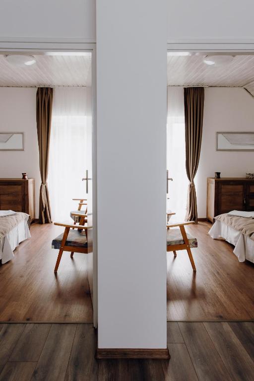 Postel nebo postele na pokoji v ubytování Nyírfa Apartman