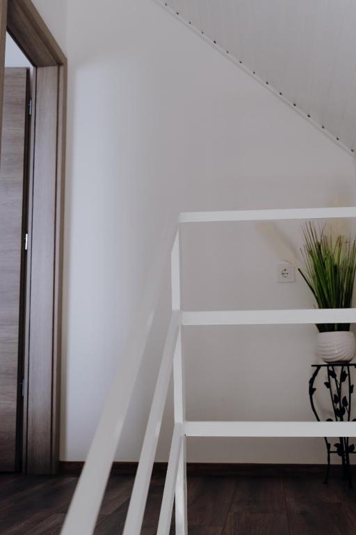 Postel nebo postele na pokoji v ubytování Nyírfa Apartman