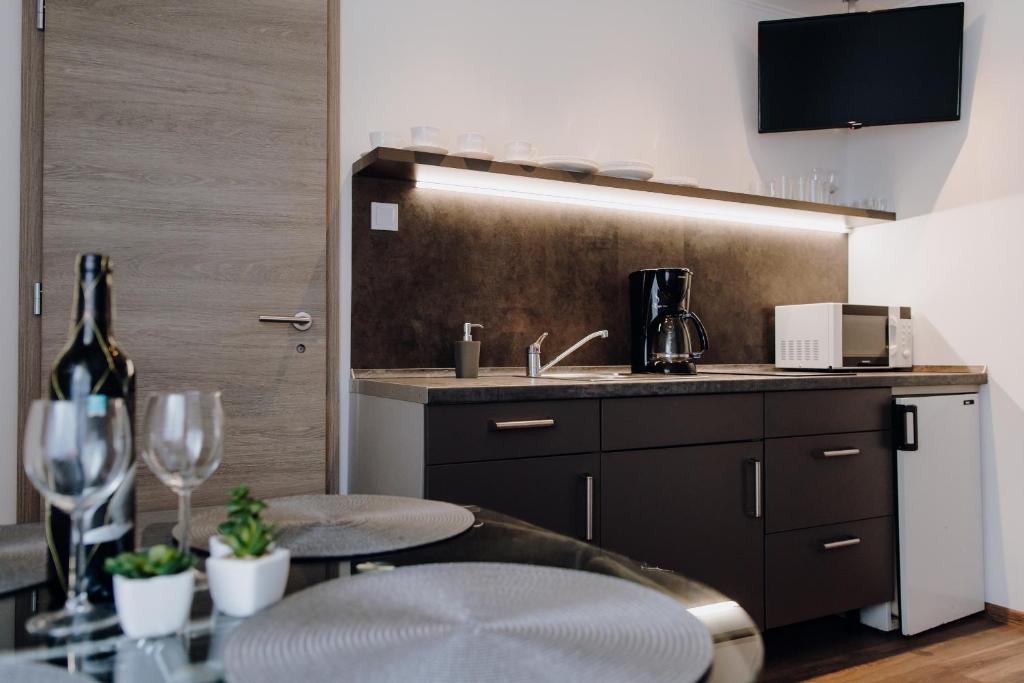 Kuchyň nebo kuchyňský kout v ubytování Nyírfa Apartman
