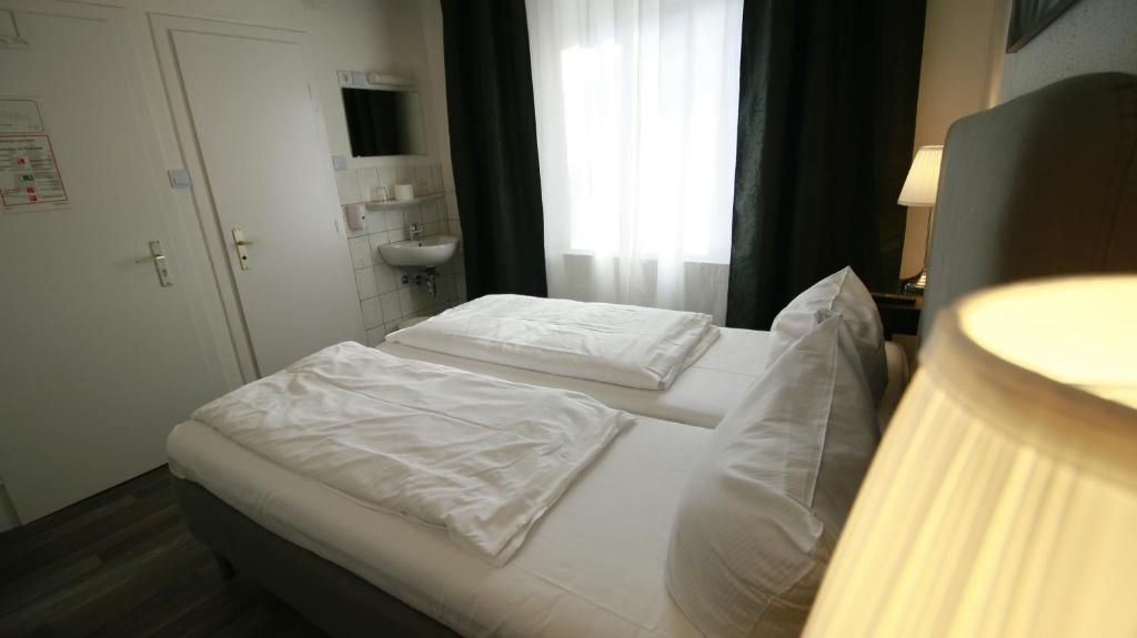 Postel nebo postele na pokoji v ubytování Hotel Bee Fang