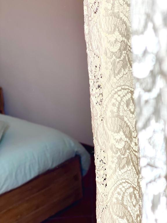 Postel nebo postele na pokoji v ubytování Enjoy Ledro B&B