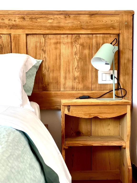 Postel nebo postele na pokoji v ubytování Enjoy Ledro B&B