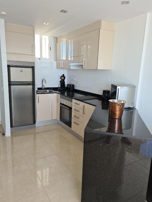 A kitchen or kitchenette at Room in Apartment - 1st line top floor apartment