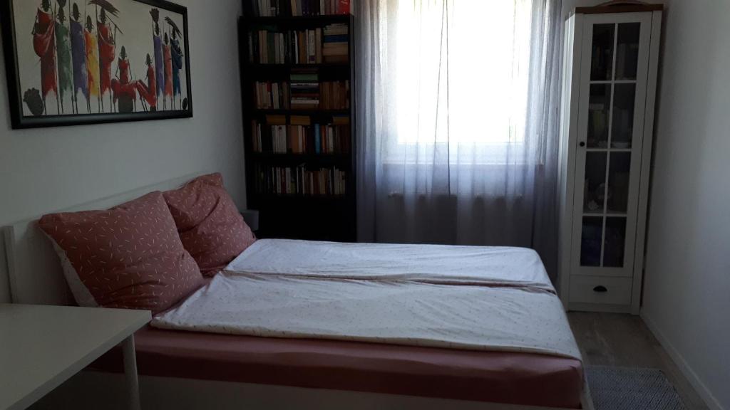 Postel nebo postele na pokoji v ubytování Fehér Rózsa Apartman