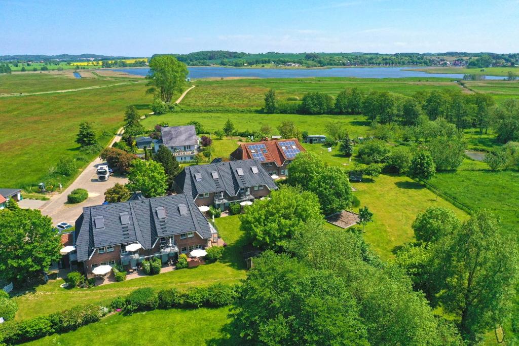 an aerial view of a house in a field at Appartementanlage Lancken-Granitz in Lancken-Granitz