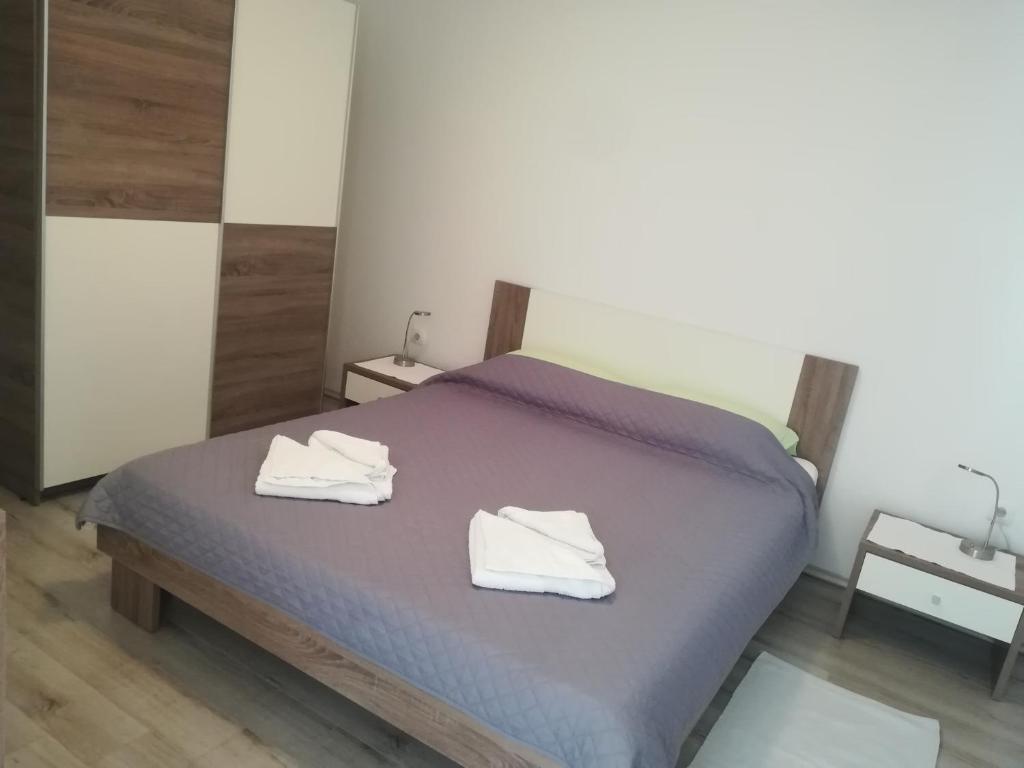 Postel nebo postele na pokoji v ubytování Apartments Vukas