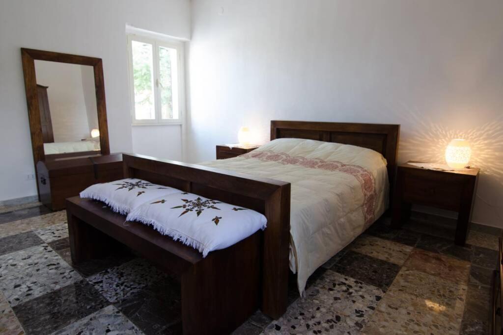 A bed or beds in a room at Trullo Marianna