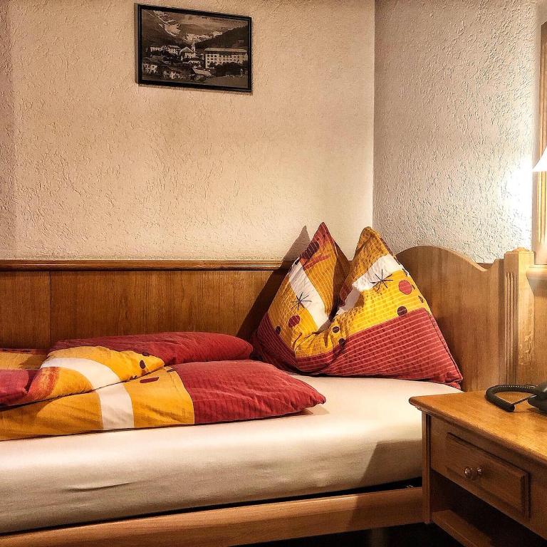 Postel nebo postele na pokoji v ubytování Alpina