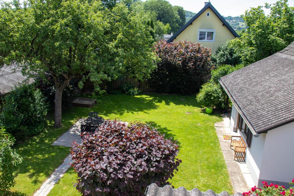 an aerial view of a yard with a tree and a house at Apfelhaus in Wagna