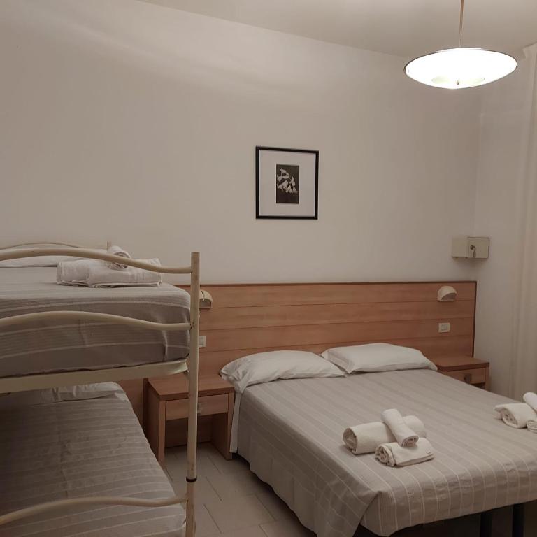 A bed or beds in a room at Hotel Brezza