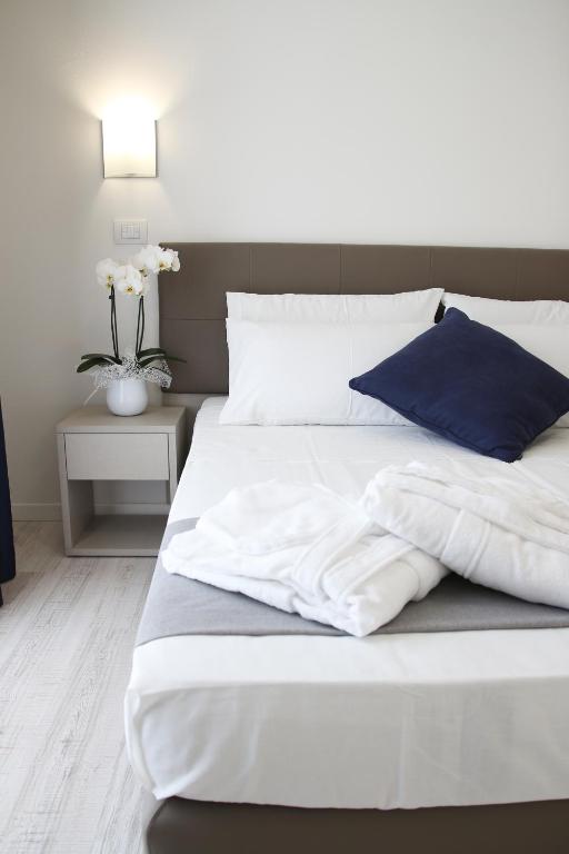 Postel nebo postele na pokoji v ubytování Hotel Arena