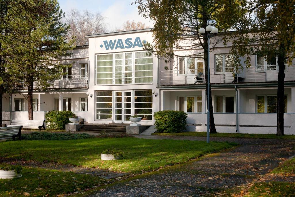 a white building with a sign that reads wasagency at Wasa Hotel & Health Center in Pärnu