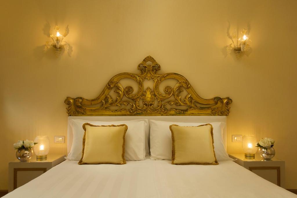 Postel nebo postele na pokoji v ubytování Relais Venezia