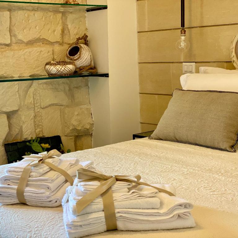 Postel nebo postele na pokoji v ubytování HABITARE Lecce & Salento