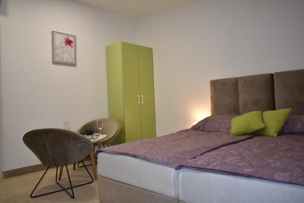 Postel nebo postele na pokoji v ubytování WooW Apartments