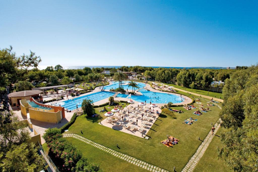 an overhead view of a large pool at a resort at Happy Camp mobile homes in Camping Village La Masseria in Gallipoli