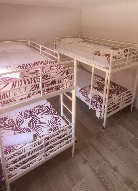 Postel nebo postele na pokoji v ubytování Hostal La Cabaña