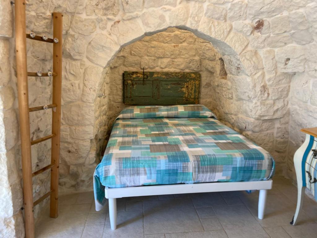Postel nebo postele na pokoji v ubytování Trullo Nadia Ostuni