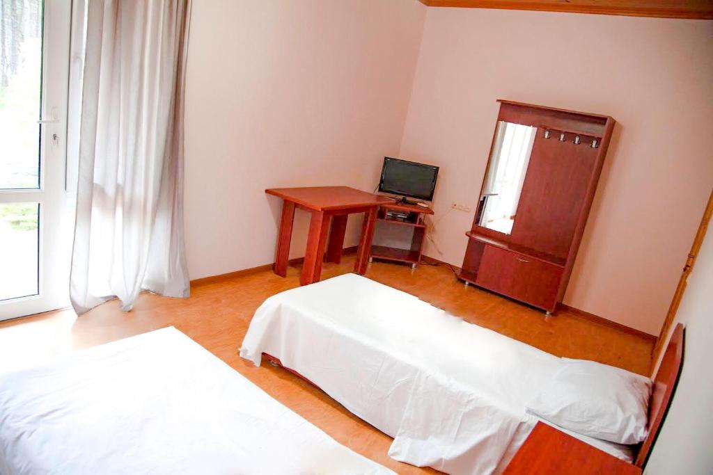 Postel nebo postele na pokoji v ubytování Hotel "Qeti"
