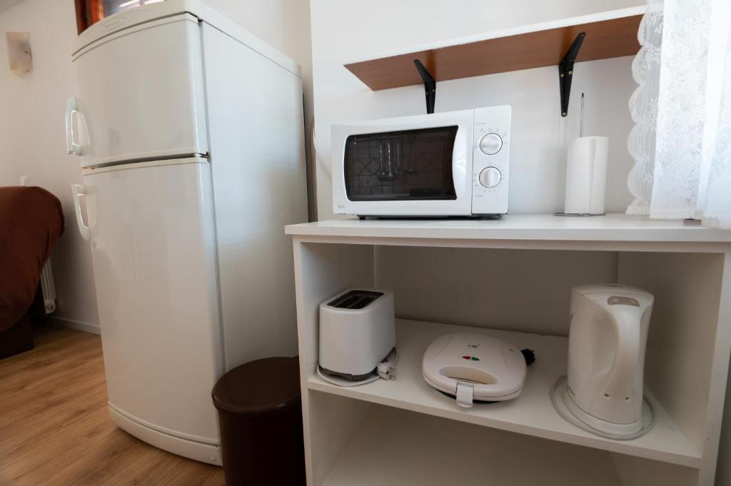 Kuchyň nebo kuchyňský kout v ubytování Apartments Onorina