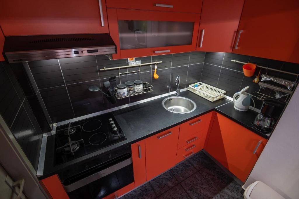 Kuchyň nebo kuchyňský kout v ubytování Apartments Onorina