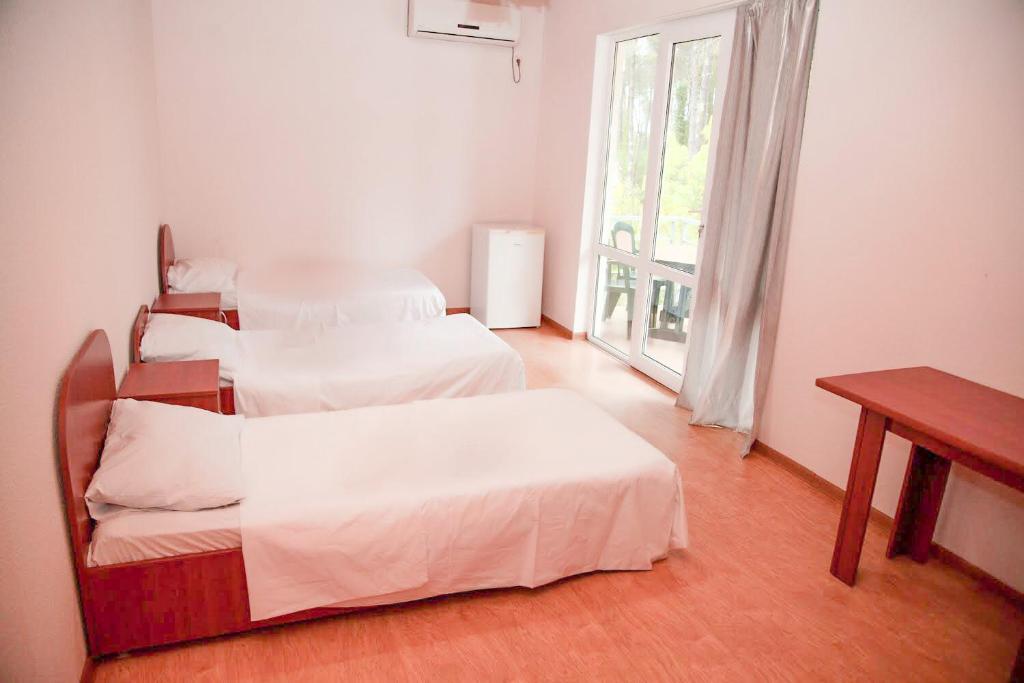 Postel nebo postele na pokoji v ubytování Hotel "Qeti"