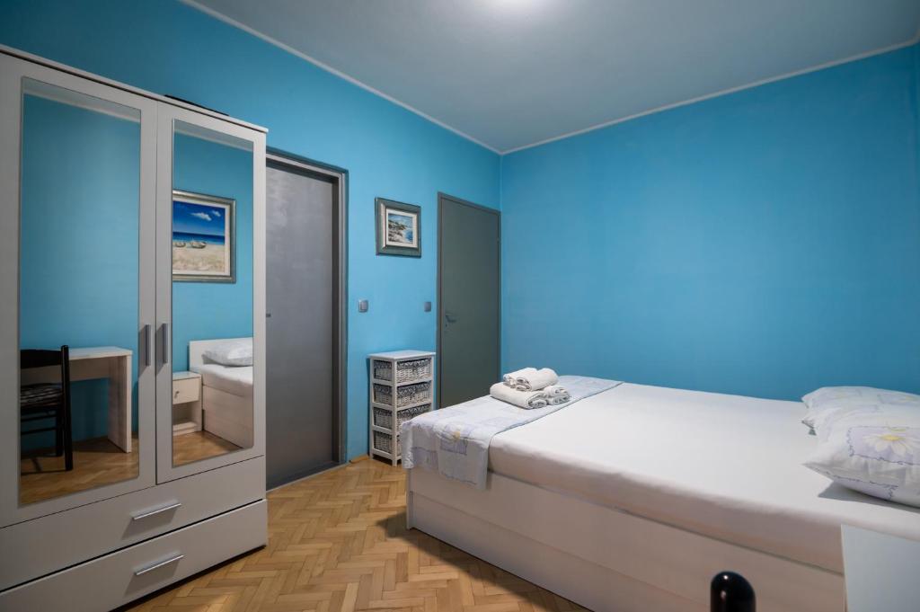 Postel nebo postele na pokoji v ubytování Apartments Onorina