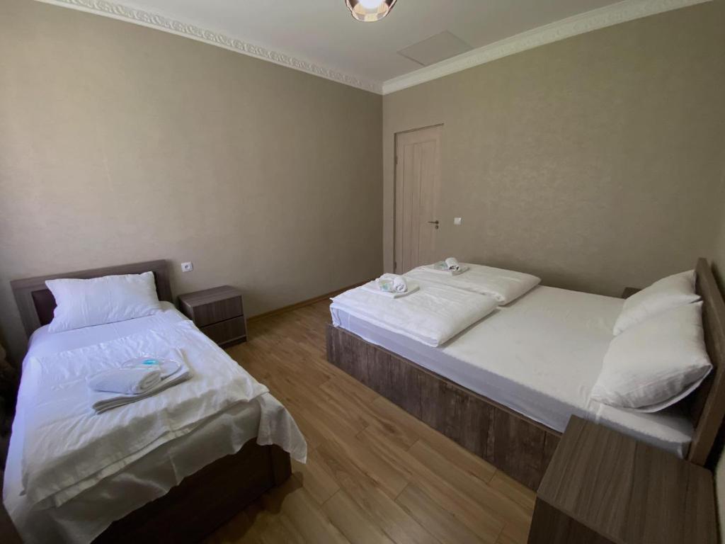 Postel nebo postele na pokoji v ubytování Geo Inn
